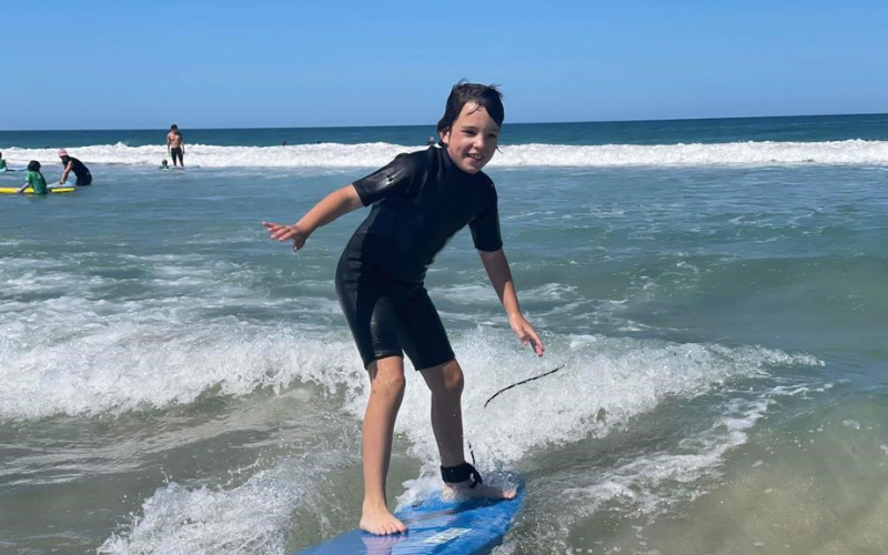 Keelan surfing a wave 